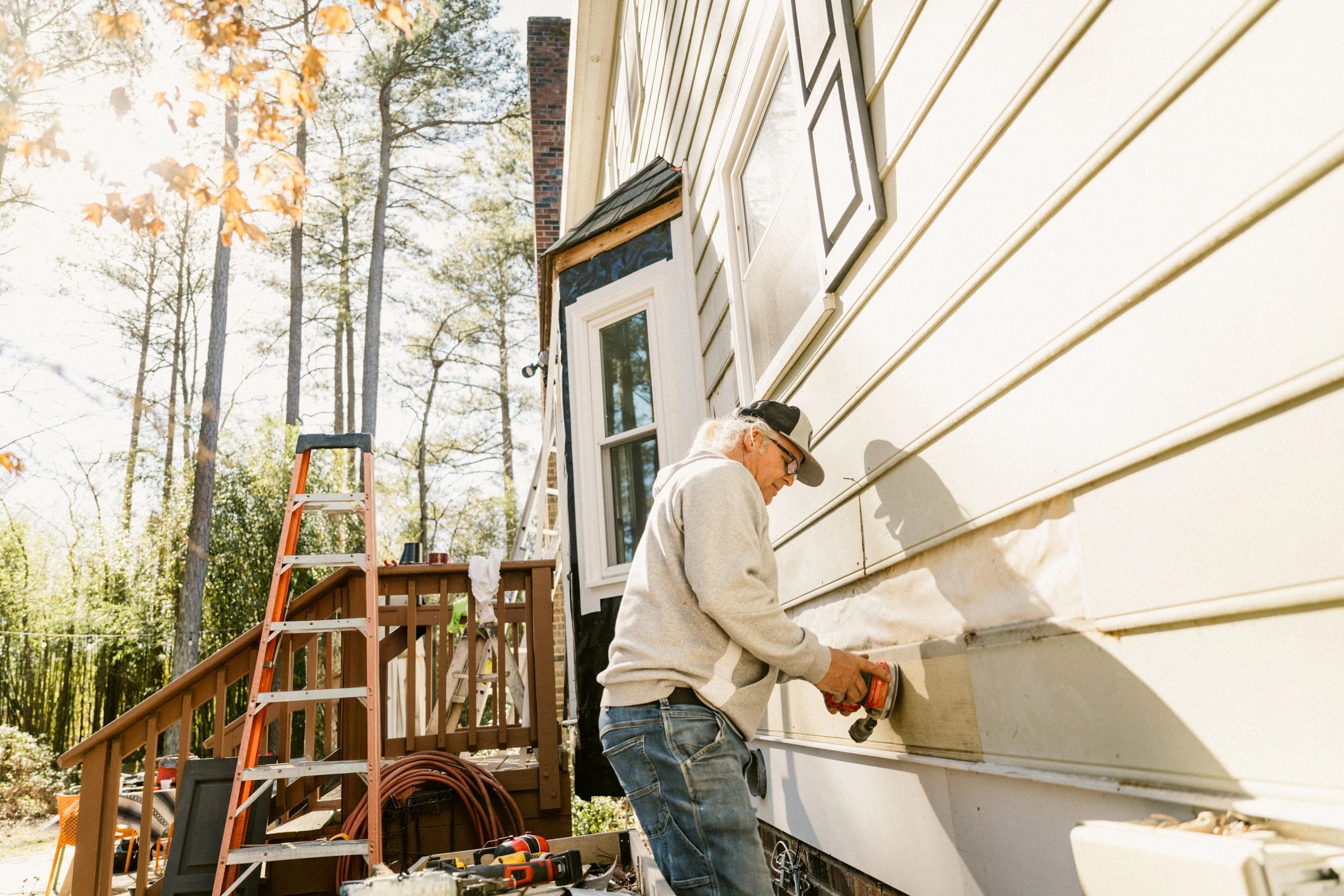 Contractor working on exterior house siding
