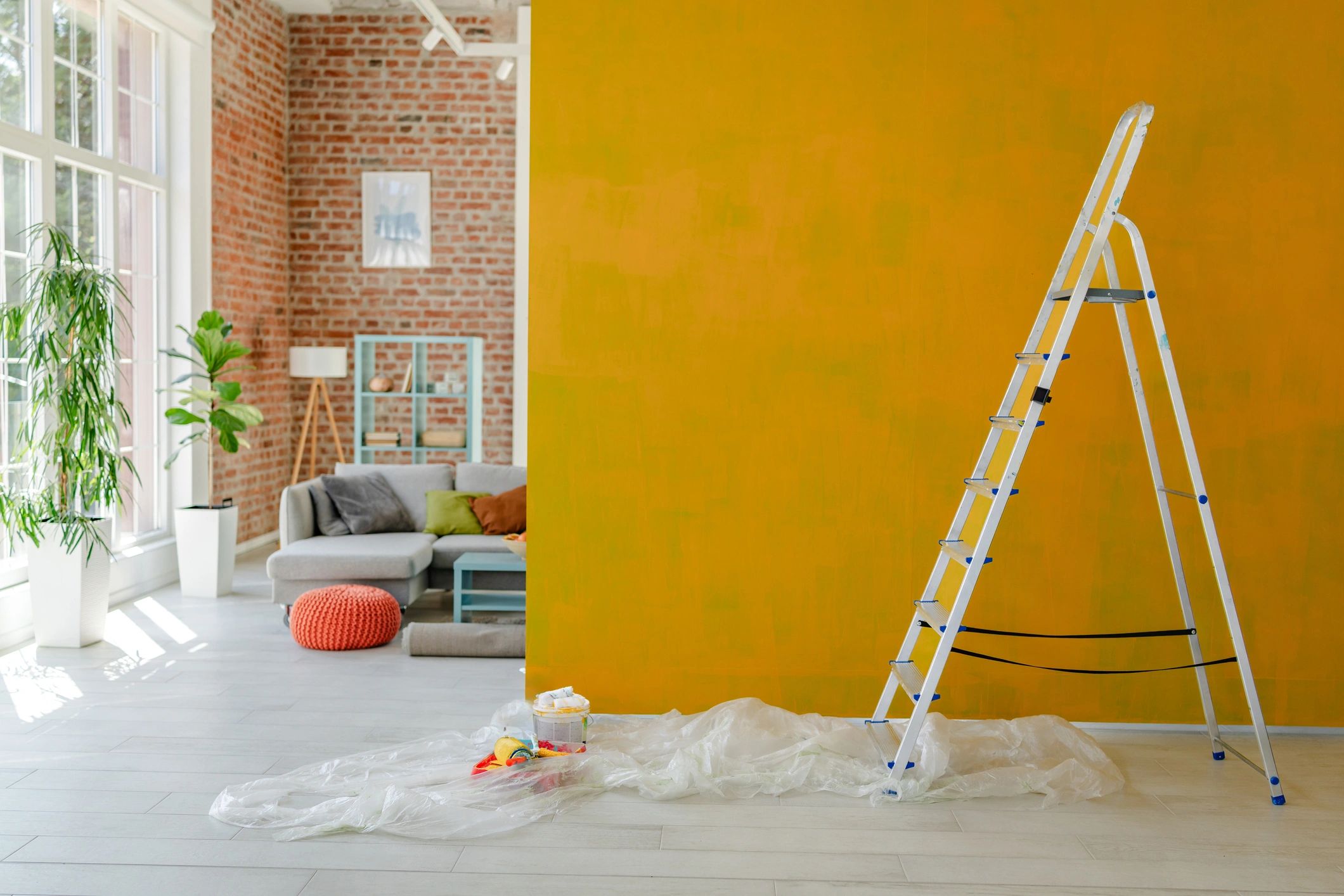 Painter’s ladder beside a freshly painted interior wall