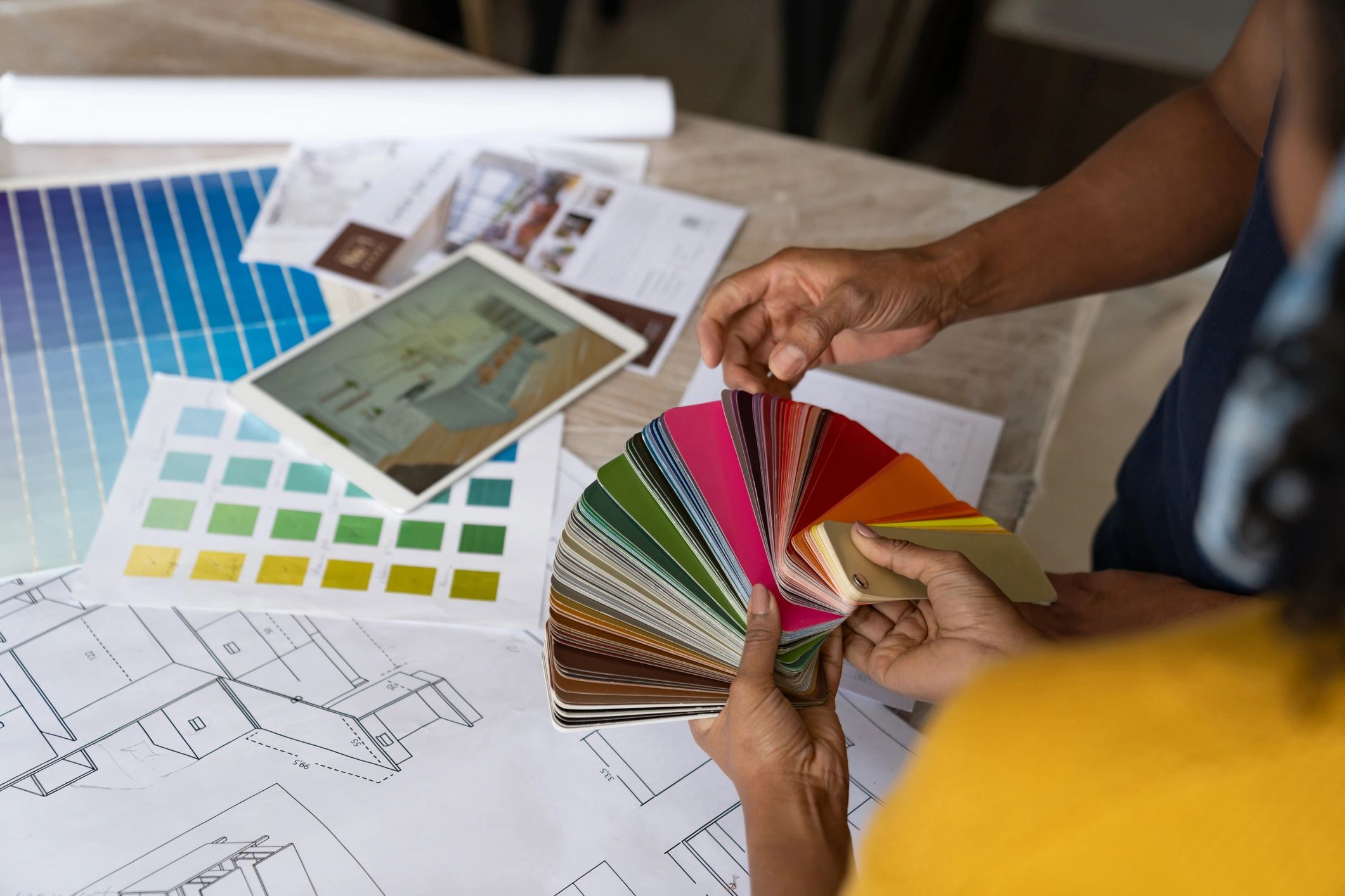 Homeowners reviewing paint color swatches during a consultation
